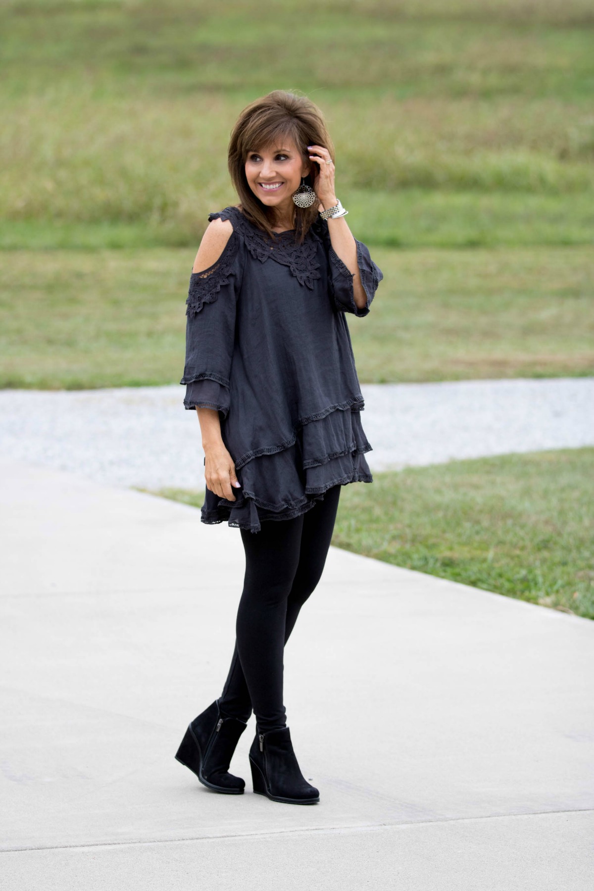 Cyndi is wearing a cold shoulder lace tunic for fall