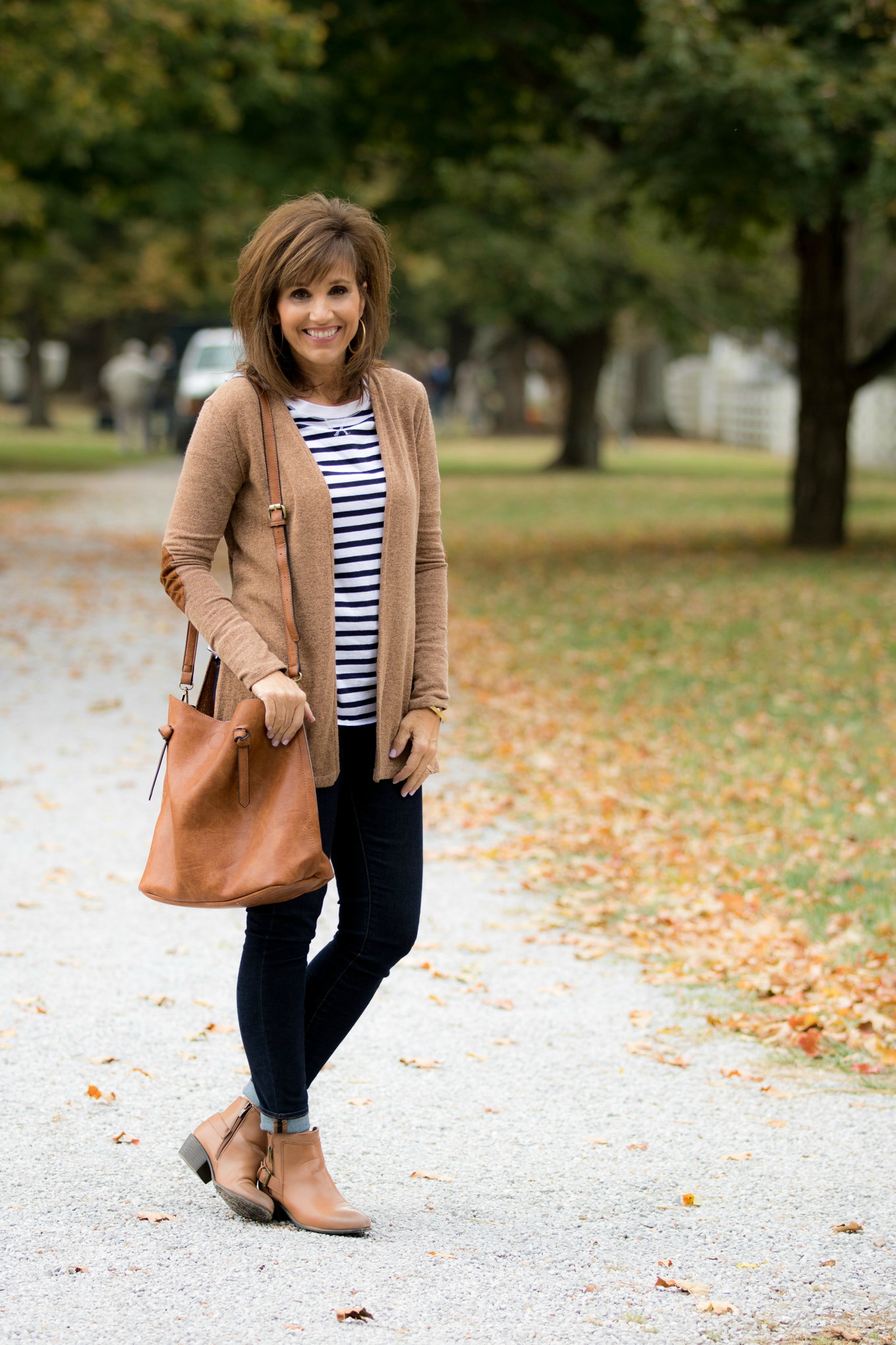 Fashion blogger, Cyndi Spivey, styling a cardigan with booties.