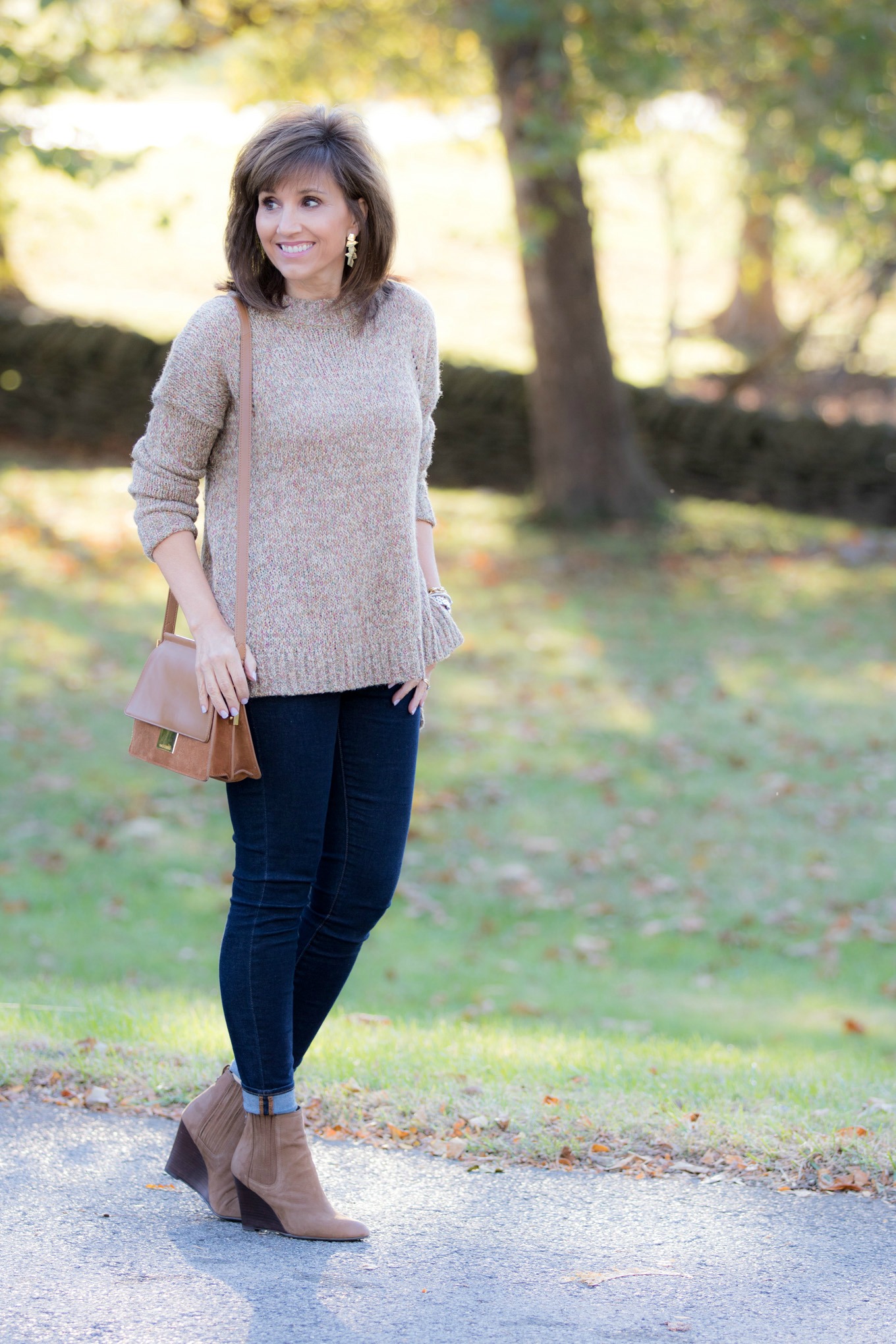 Fashion blogger Cyndi Spivey styling a casual fall outfit from Nordstrom for women over 40.
