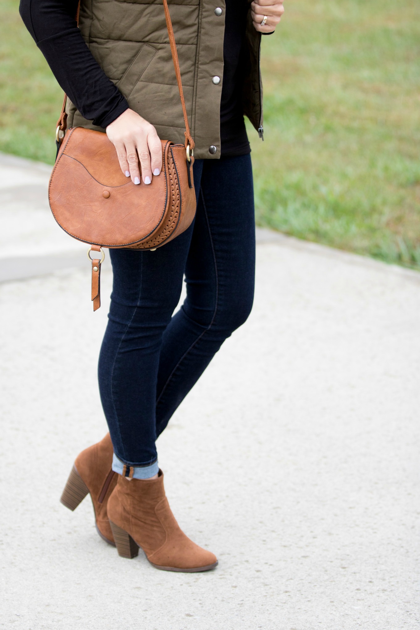 Fashion blogger, Cyndi Spivey, styling a hooded vest for fall.
