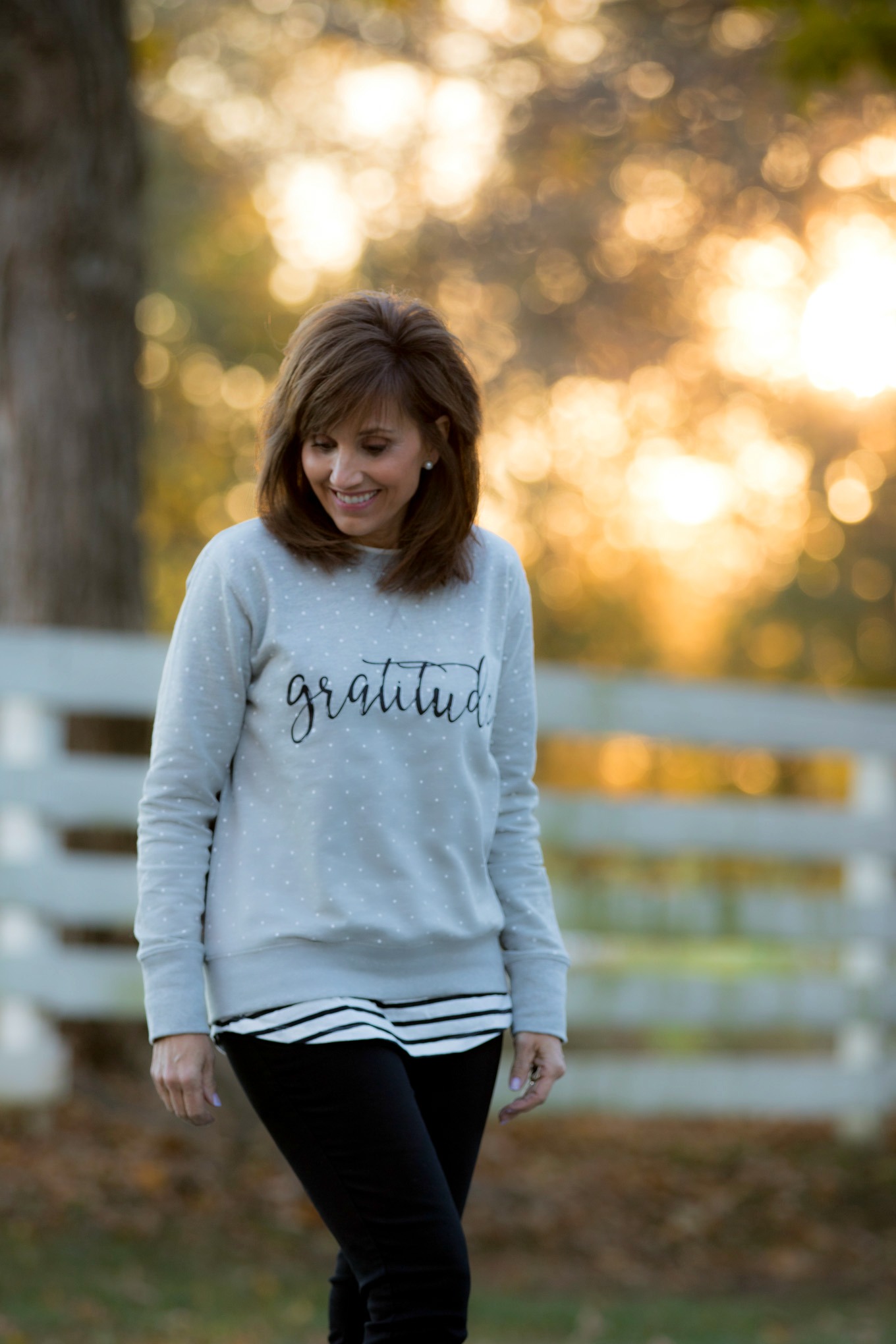 Fashion blogger, Cyndi Spivey, sharing a gratitude sweatshirt from Glamour Farms Boutique.