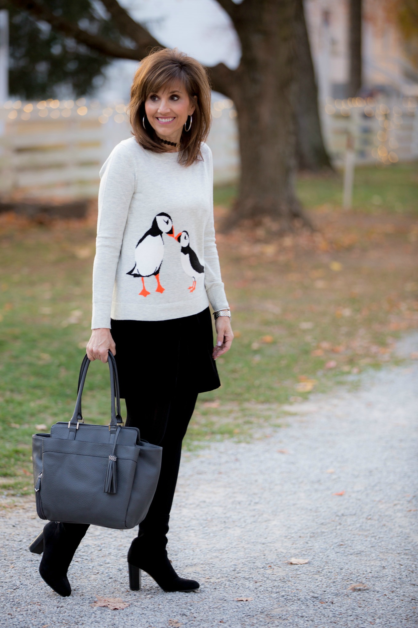 Fashion blogger, Cyndi Spivey, styling a velvet skirt for winter fashion.