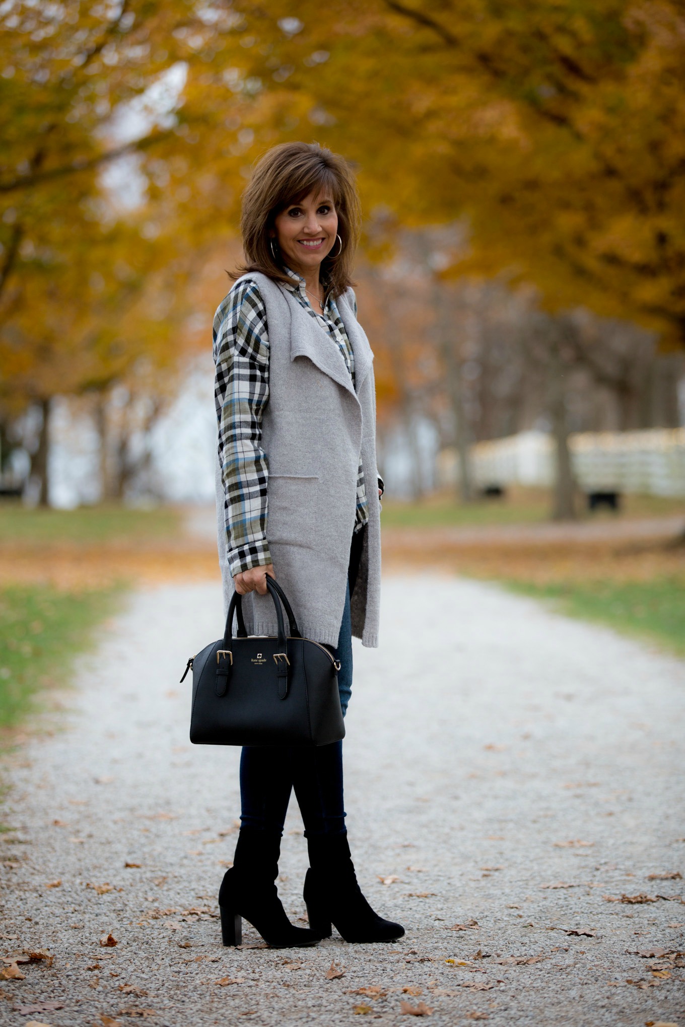 Fashion blogger, Cyndi Spivey, styling a grey vest for Cyber Monday from Glamour Farms.