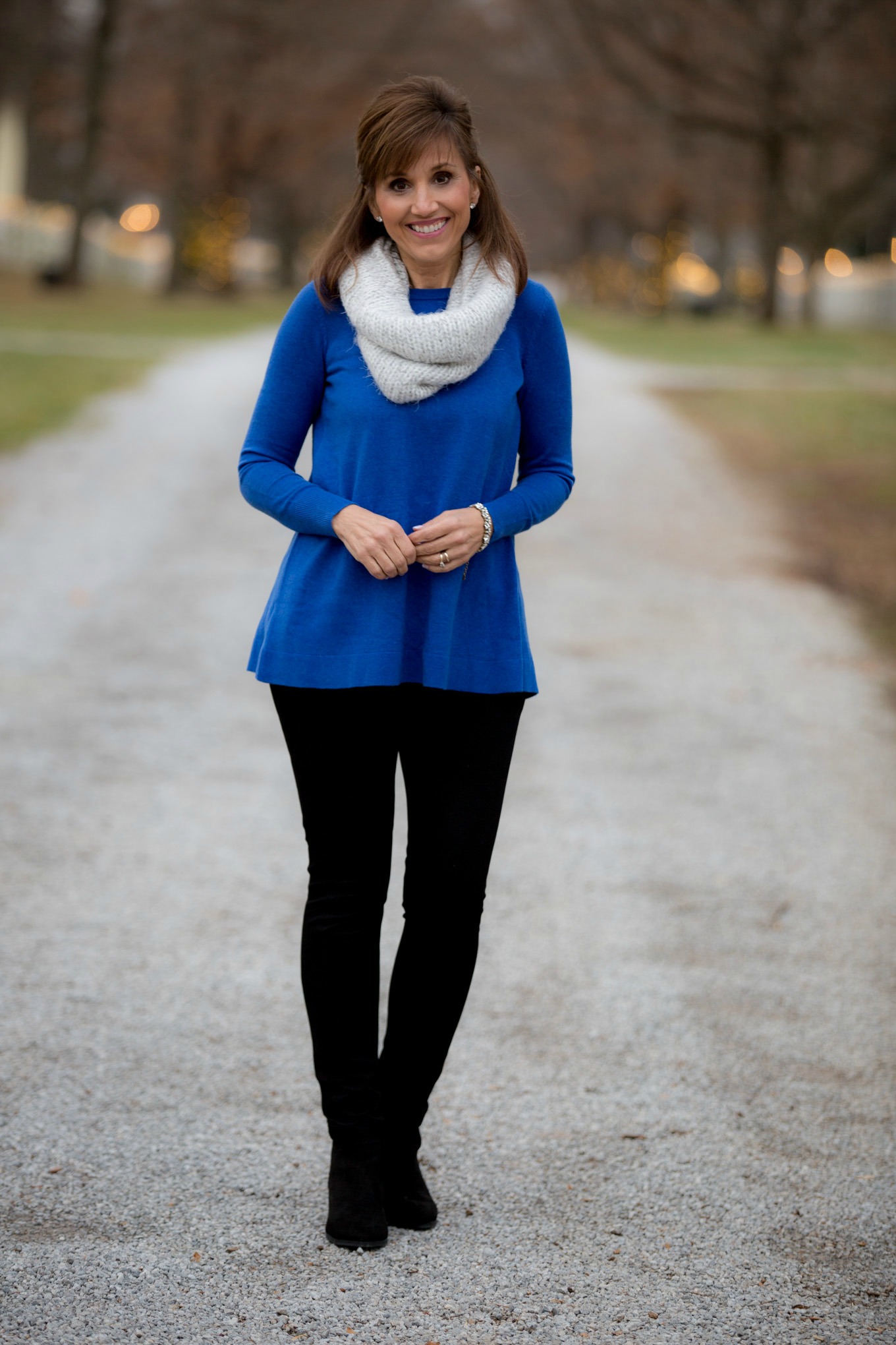 Fashion blogger, Cyndi Spivey, styling a royal blue sweater from Loft. 